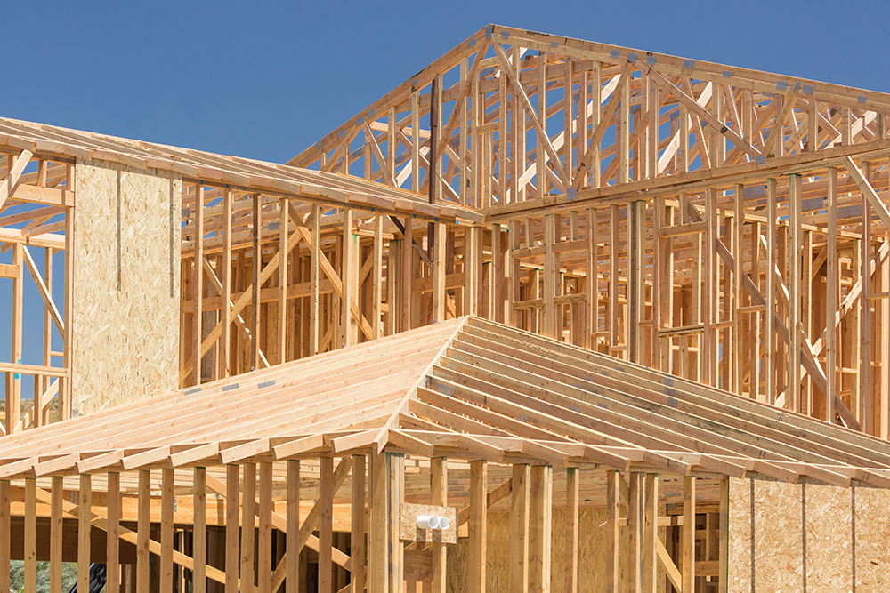 Wood framing of a house being constructed while preforming home inspection services